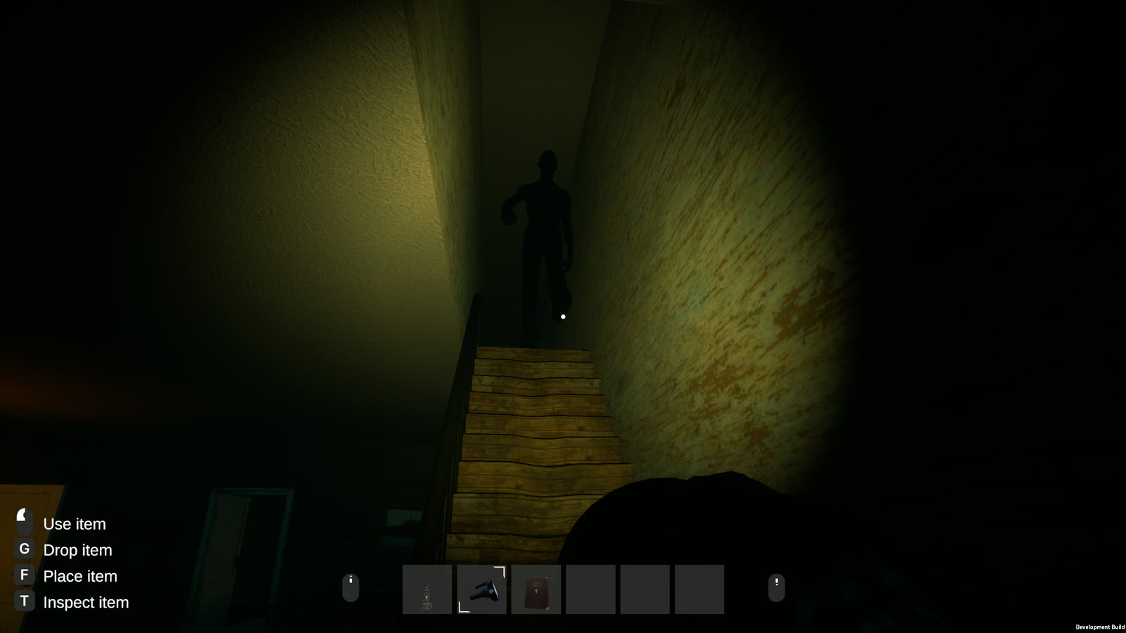A flashlight beam climbs a narrow wooden staircase to a dark figure waiting at the top.