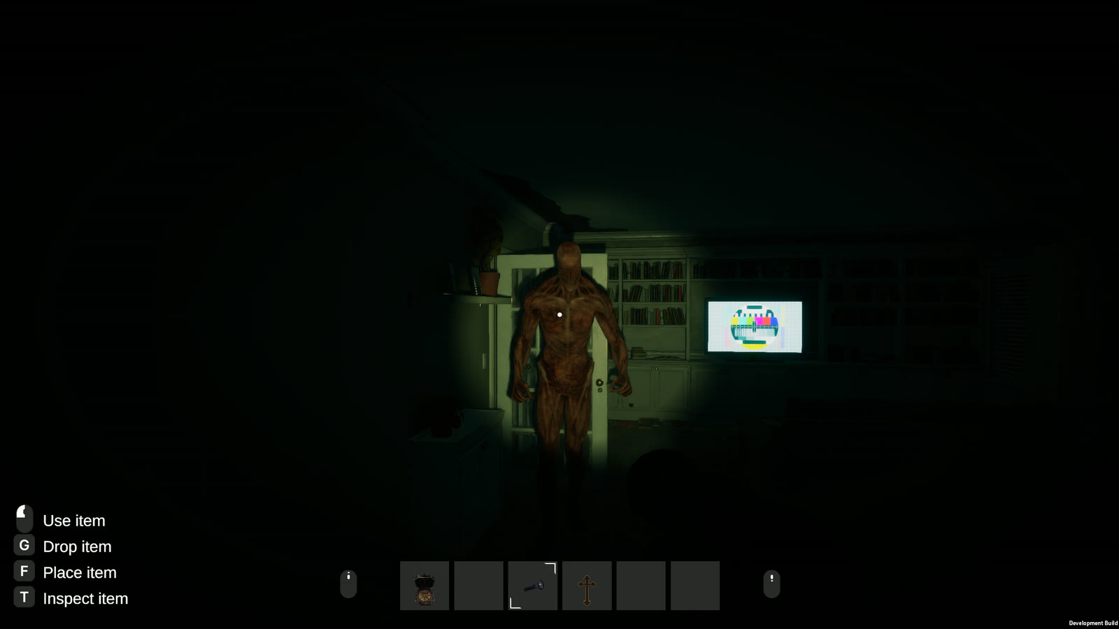 A skinless, blood-red demon caught in a flashlight beam beside a television showing a test pattern.